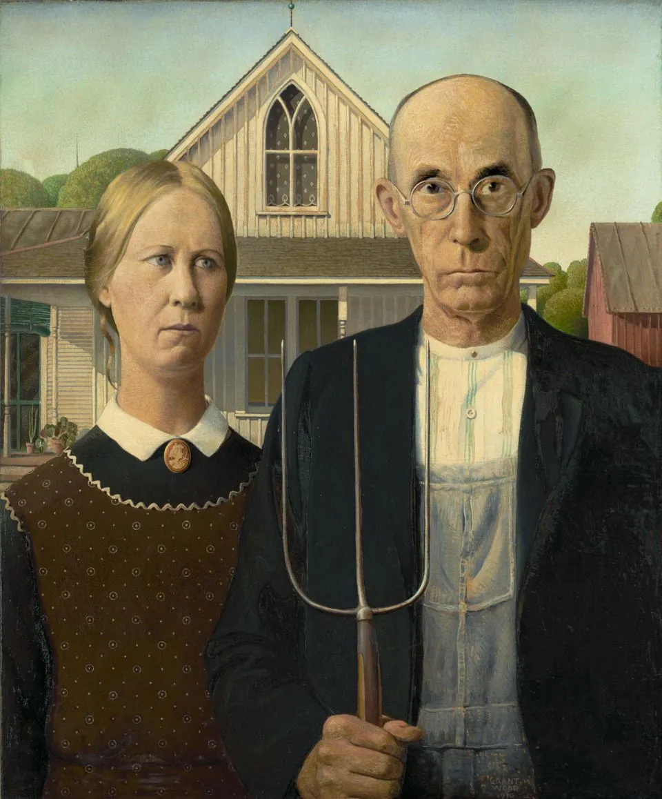 Grant Wood’s American Gothic: a stern man with a pitchfork and a woman beside him in front of a white farmhouse with a Gothic window.