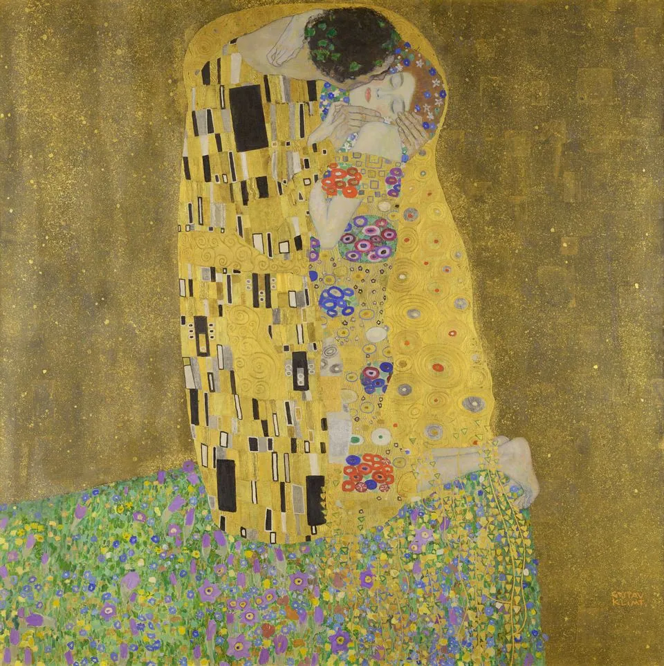 Klimt’s The Kiss: a couple embracing, wrapped in golden patterned robes, on a flowered meadow.